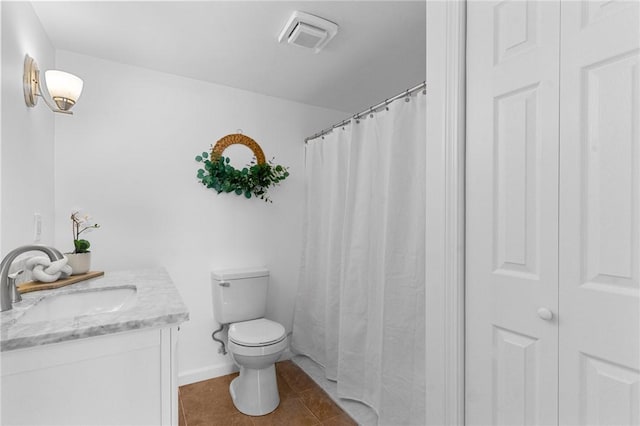 full bath featuring toilet, vanity, visible vents, a closet, and tile patterned floors