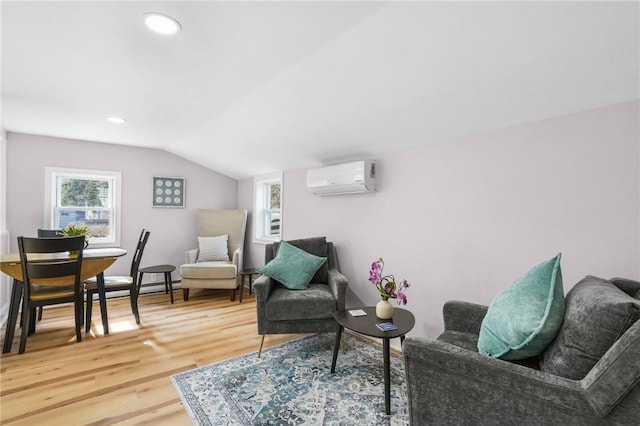 living area featuring vaulted ceiling, a wall mounted AC, wood finished floors, and recessed lighting