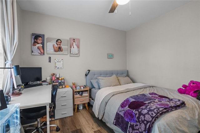 bedroom with ceiling fan and wood finished floors