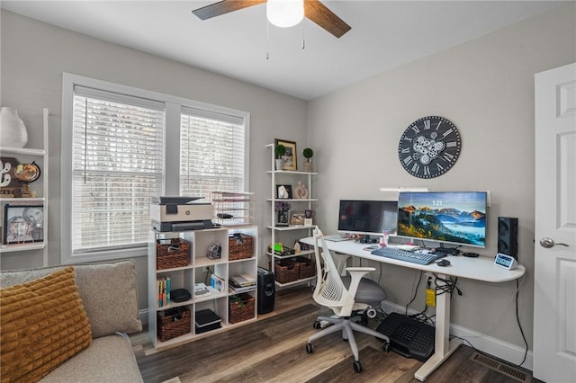 office space with ceiling fan, baseboards, and wood finished floors