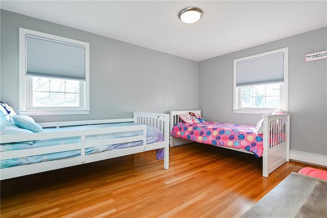 bedroom featuring wood finished floors