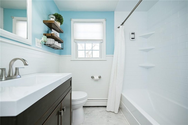 full bathroom featuring marble finish floor, a wainscoted wall, shower / bathtub combination with curtain, toilet, and a baseboard heating unit