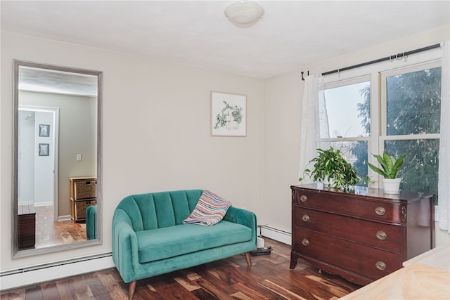 sitting room featuring dark wood-style floors and baseboard heating