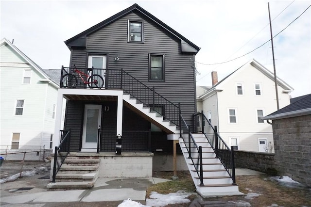 view of front of house with stairs