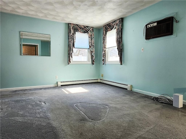 unfurnished room featuring carpet floors, baseboards, baseboard heating, and an AC wall unit