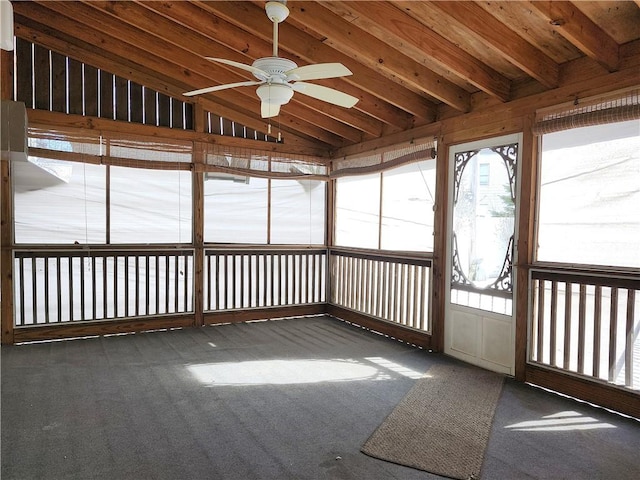 unfurnished sunroom with lofted ceiling and a ceiling fan