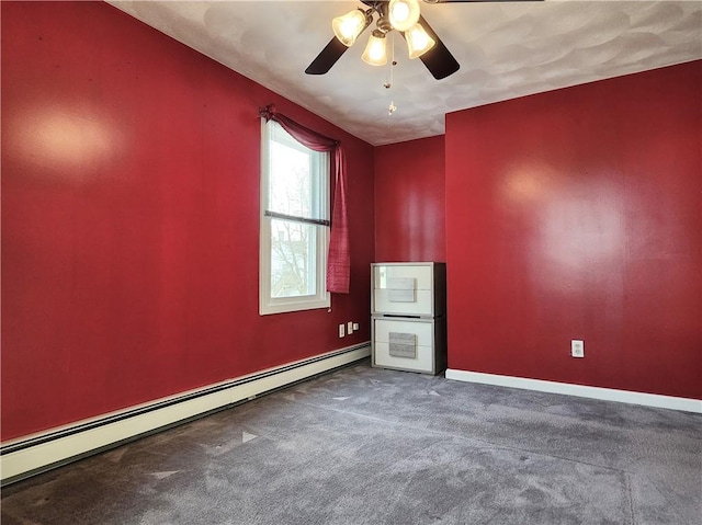 carpeted empty room with a ceiling fan, a baseboard radiator, and baseboards