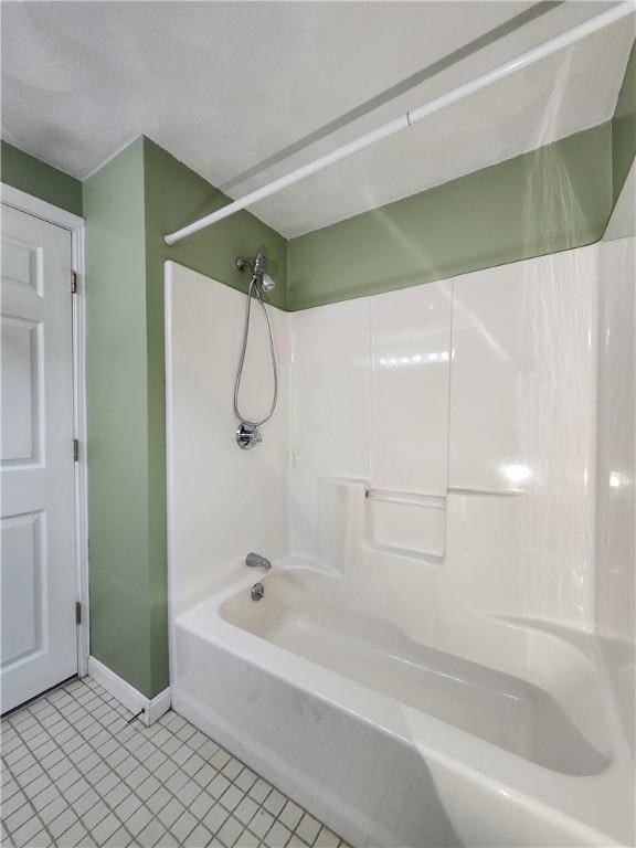 full bathroom featuring shower / bathing tub combination, tile patterned floors, and baseboards