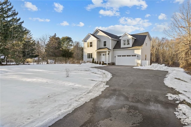 view of front facade featuring driveway and an attached garage