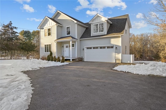 view of front of house with driveway and board and batten siding