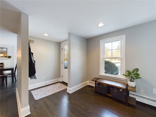 entrance foyer with baseboards, visible vents, hardwood / wood-style flooring, baseboard heating, and recessed lighting