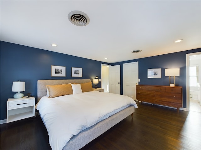 bedroom with wood finished floors, visible vents, and recessed lighting