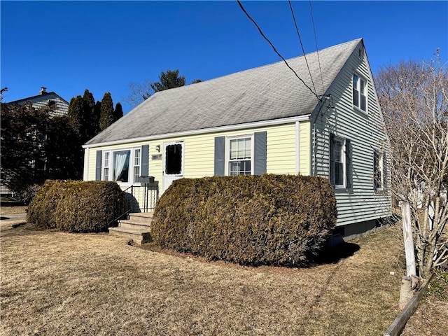 view of front of house with a shingled roof