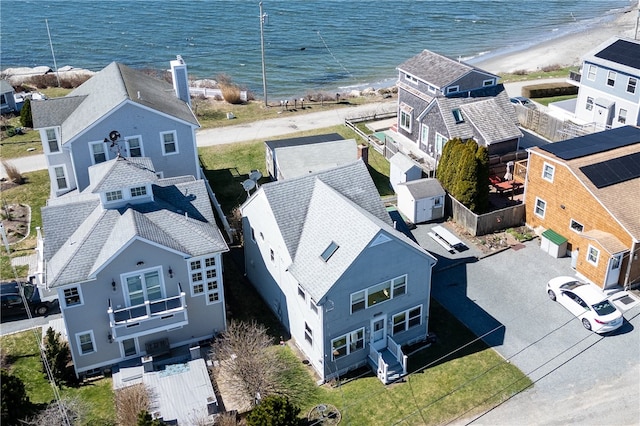 birds eye view of property featuring a view of the beach and a water view