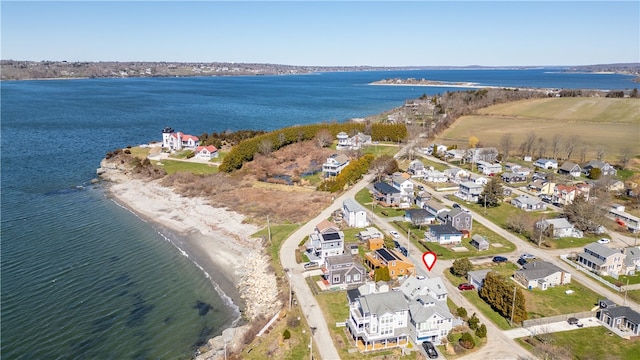 drone / aerial view with a water view and a residential view