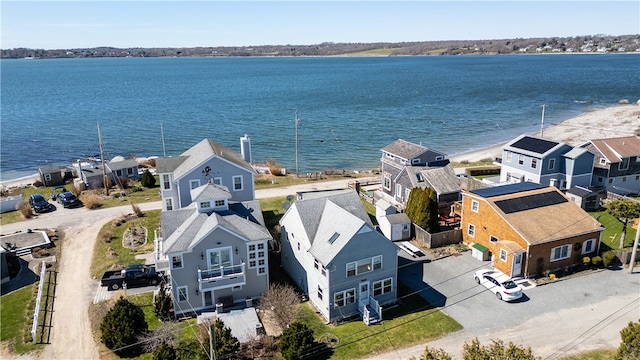 bird's eye view featuring a water view and a residential view