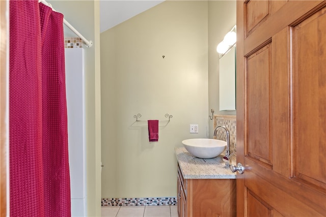 full bathroom featuring a shower with curtain, vanity, and tile patterned floors