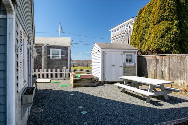 view of shed with fence