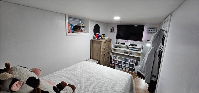 bedroom with wood finished floors