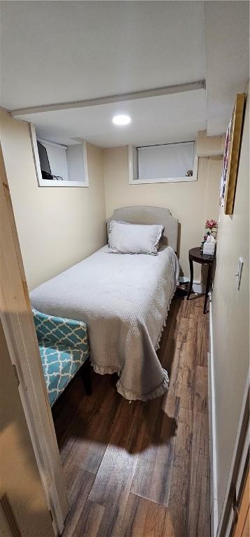 bedroom featuring dark wood-style flooring