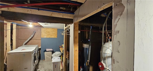 unfinished basement featuring washer and clothes dryer