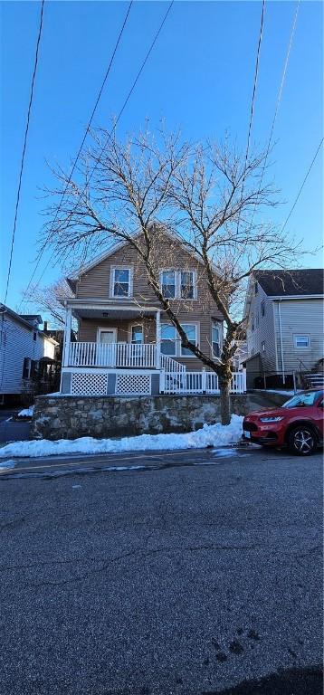 view of front of property featuring covered porch