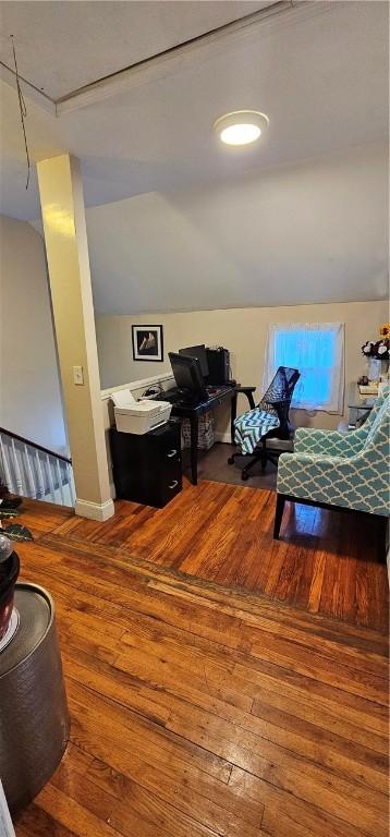 interior space with vaulted ceiling and hardwood / wood-style floors