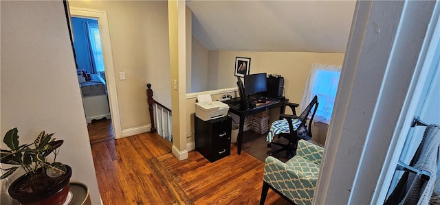 office featuring vaulted ceiling, dark wood finished floors, and baseboards