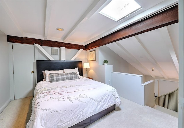 bedroom featuring lofted ceiling with beams, visible vents, and light colored carpet