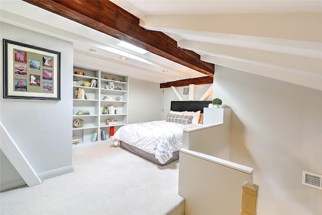 bedroom with carpet floors, baseboards, visible vents, and beam ceiling