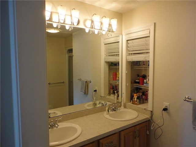 bathroom with a sink and double vanity