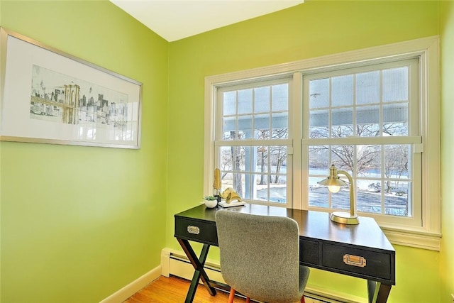 office area with wood finished floors, a wealth of natural light, and baseboards