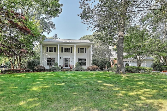 neoclassical / greek revival house with a front lawn