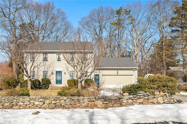 colonial house featuring an attached garage