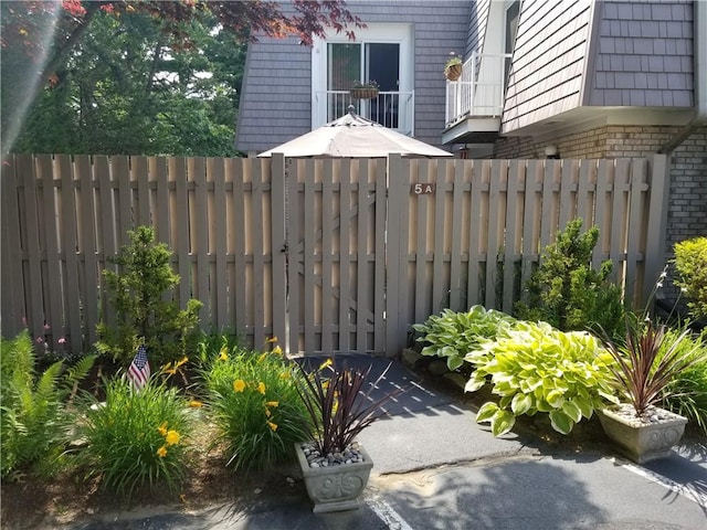 view of gate with fence