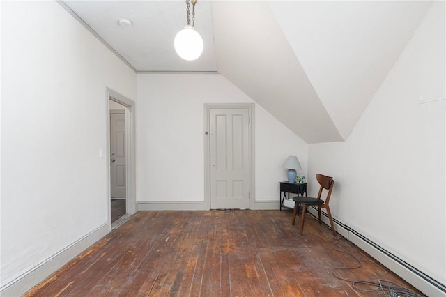 additional living space with a baseboard radiator, vaulted ceiling, baseboards, and hardwood / wood-style flooring