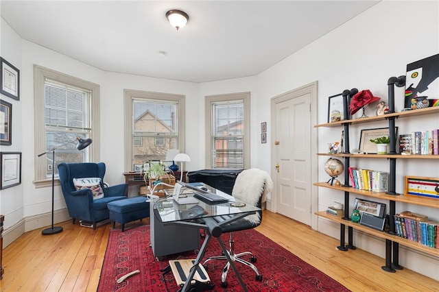 home office with hardwood / wood-style floors, baseboards, and a wealth of natural light