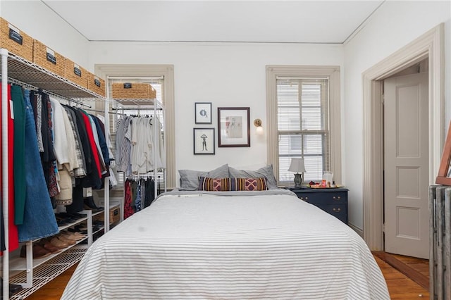 bedroom with a closet and wood finished floors