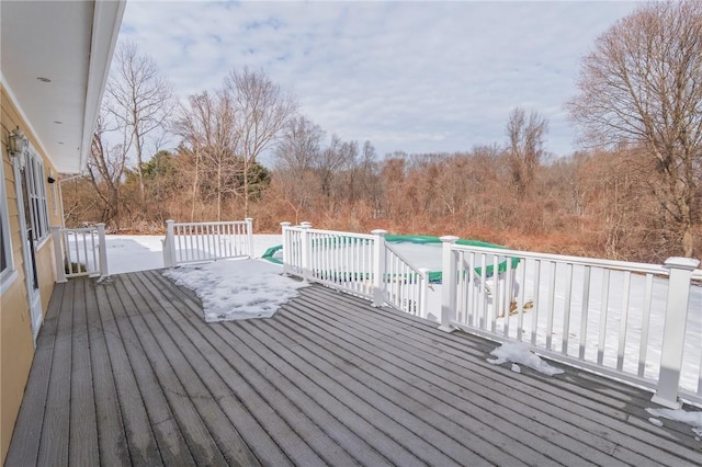 wooden deck featuring a pool