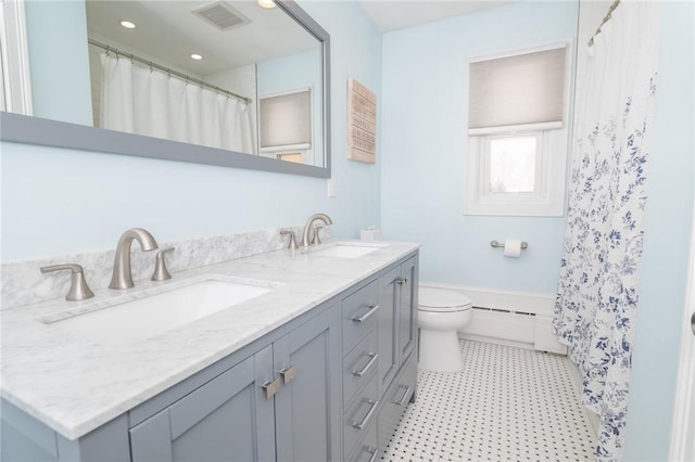 full bath featuring toilet, a baseboard radiator, visible vents, and a sink