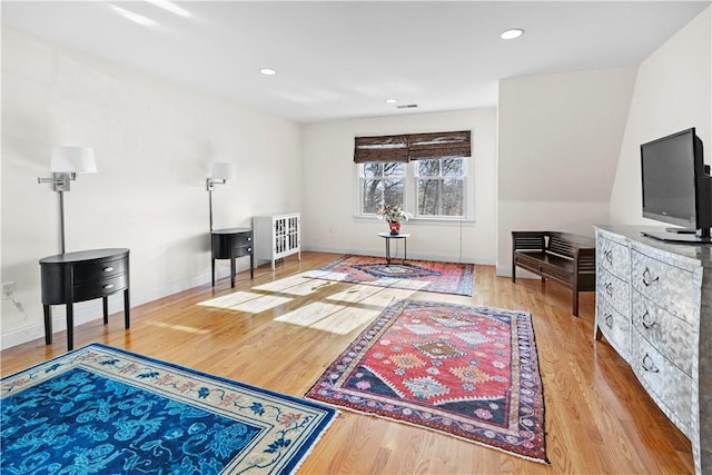 sitting room featuring light wood-type flooring, visible vents, baseboards, and recessed lighting