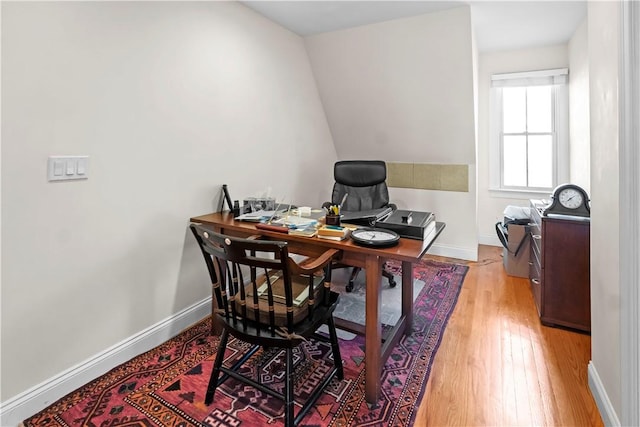 home office featuring light wood-style flooring and baseboards