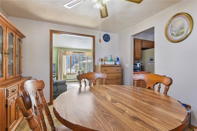 dining space featuring ceiling fan