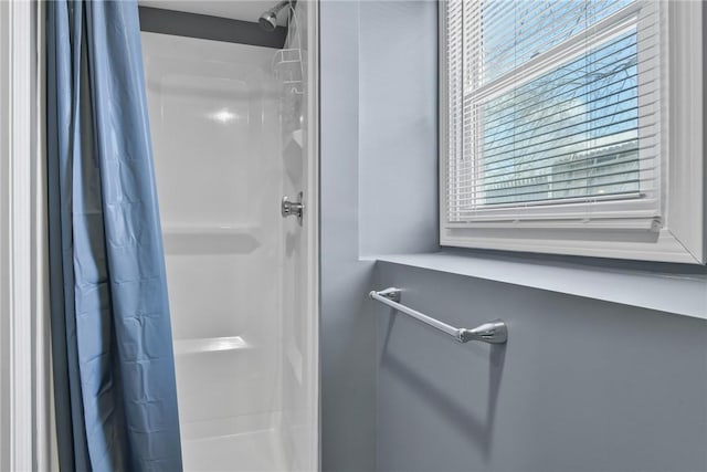 full bathroom with a shower stall