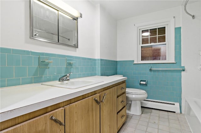 full bathroom with a baseboard radiator, toilet, a wainscoted wall, vanity, and tile walls