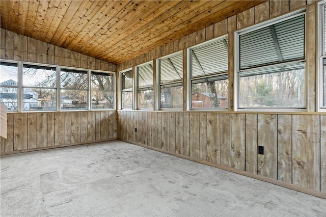 unfurnished sunroom with vaulted ceiling and wooden ceiling