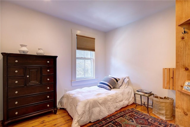 bedroom featuring light wood-style flooring