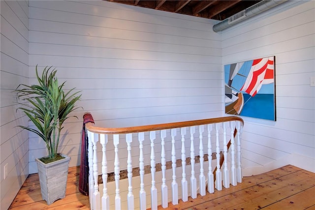 bedroom with wood walls