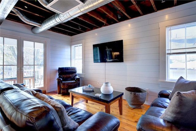 living room featuring visible vents and hardwood / wood-style flooring