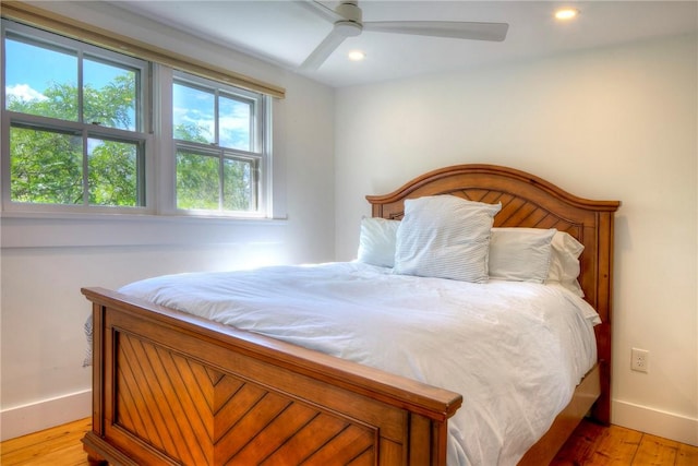 bedroom with recessed lighting, baseboards, ceiling fan, and light wood finished floors